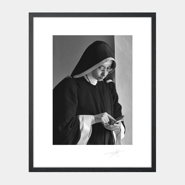 Nun with a phone